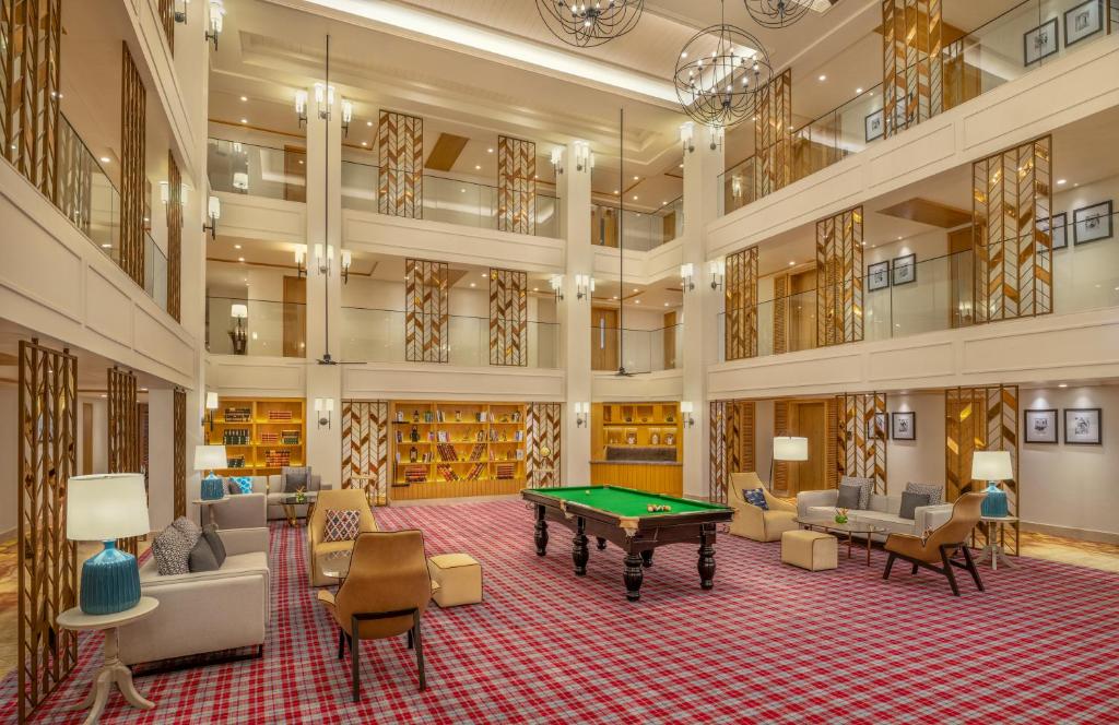 a large room with a pool table in it at The Residency Towers Puducherry in Puducherry