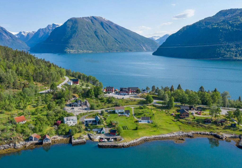 an aerial view of a home on the shore of a lake at Dragsvik Fjordhotel in Balestrand