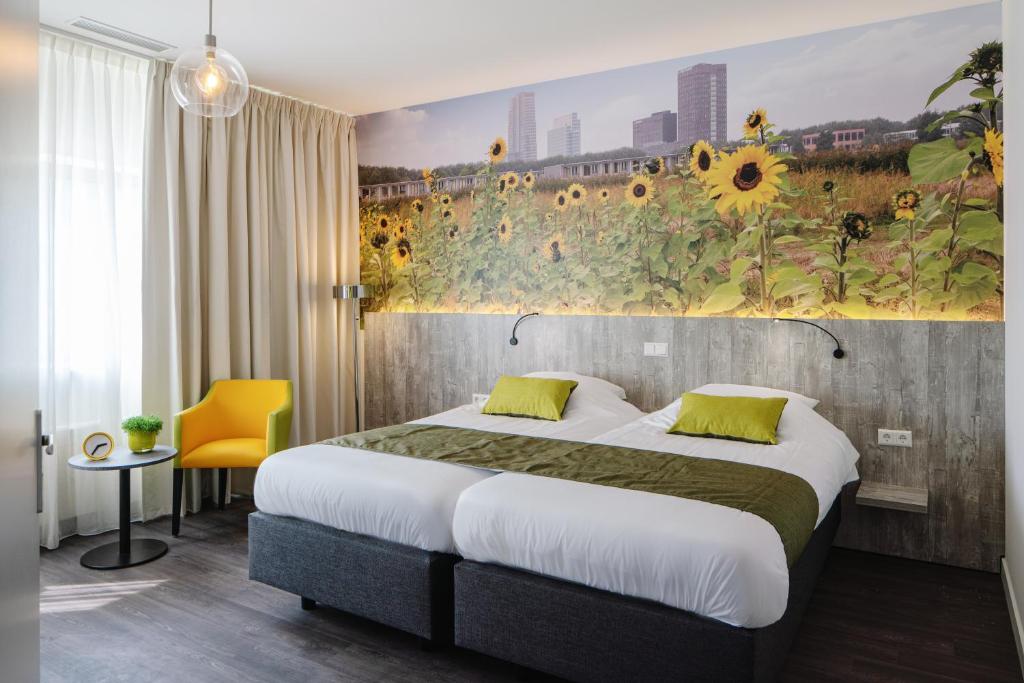Postel nebo postele na pokoji v ubytování ibis Styles Almere