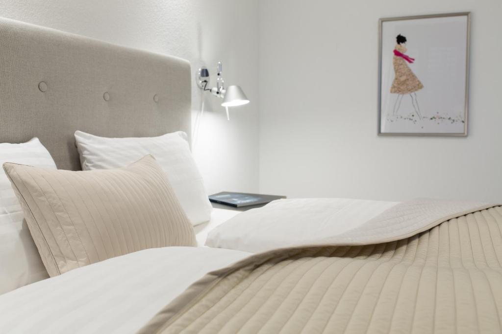 Postel nebo postele na pokoji v ubytování Hotel SiX