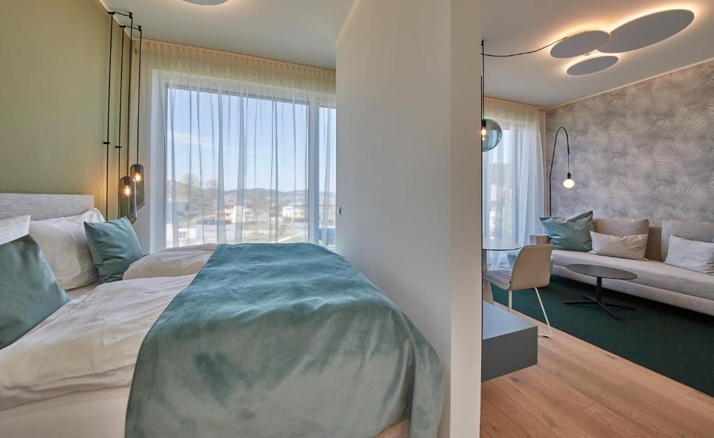 Postel nebo postele na pokoji v ubytování Hermitage Apartments