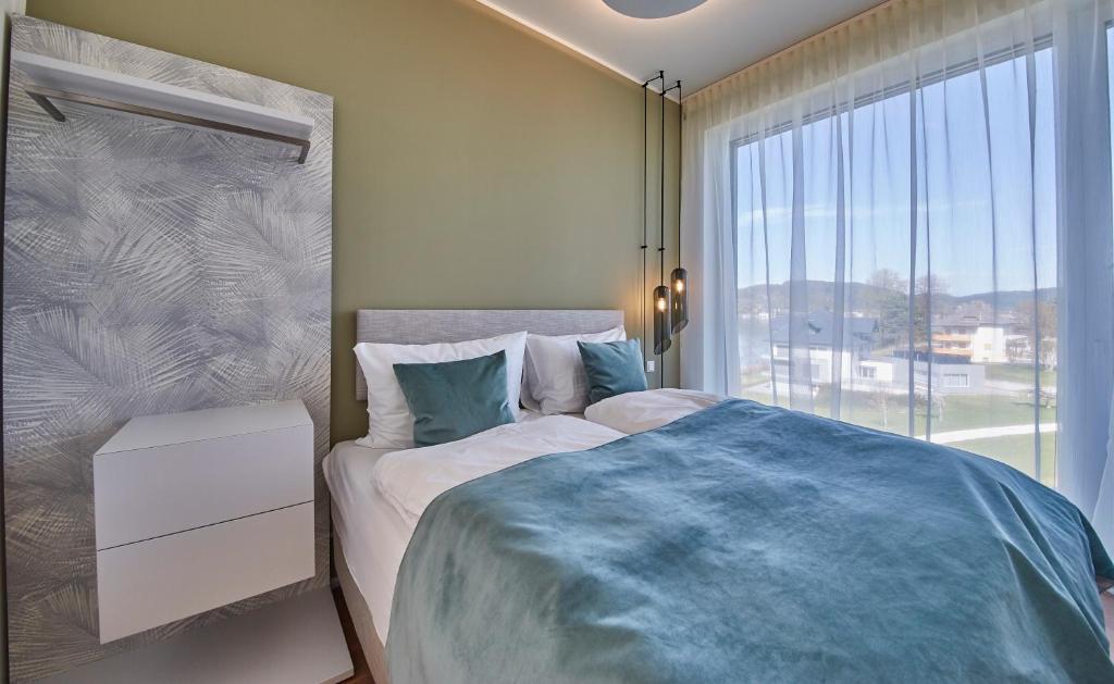 Postel nebo postele na pokoji v ubytování Hermitage Apartments
