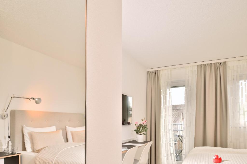 Postel nebo postele na pokoji v ubytování Hotel SiX
