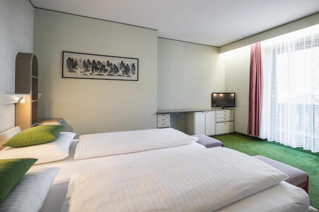 Posteľ alebo postele v izbe v ubytovaní Kronplatz Lodge Dolomites