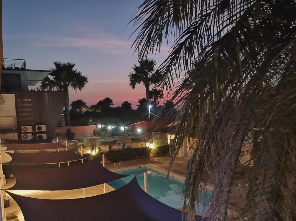 a swimming pool at night with a skate park at Ocean Villa Heights in Brufut