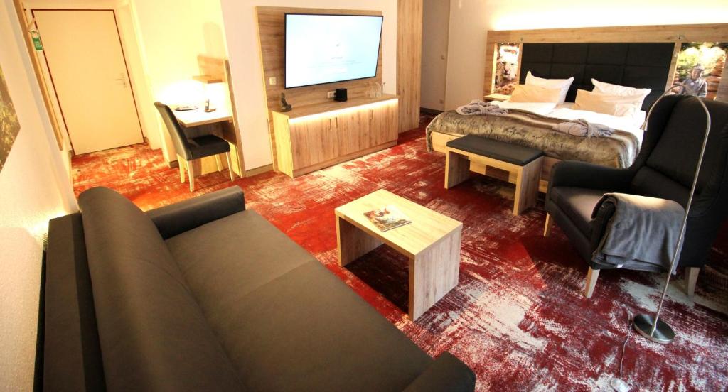 Postel nebo postele na pokoji v ubytování Wellness & Ayurveda Hotel Am Eichenberg