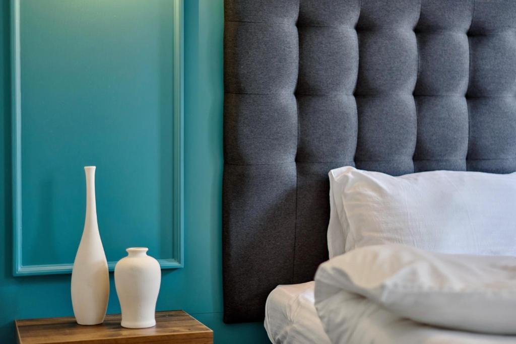 Postel nebo postele na pokoji v ubytování Hotel Buninn