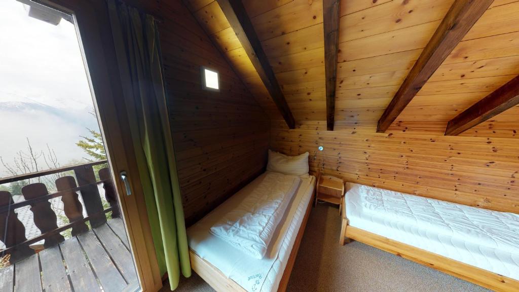 Postel nebo postele na pokoji v ubytování Tschuggen 59