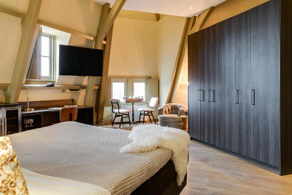 Letto o letti in una camera di Brasss Hotel Suites