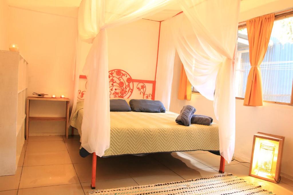 Postel nebo postele na pokoji v ubytování Madre Selva Hostel