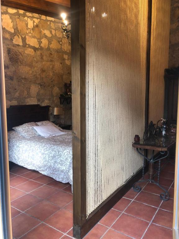 Postel nebo postele na pokoji v ubytování Casa Rural "Rincón del Edén"