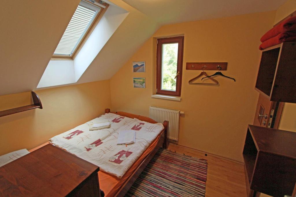 Postel nebo postele na pokoji v ubytování Chaty Tatra