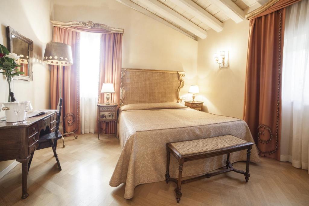 Postel nebo postele na pokoji v ubytování Relais Fra' Lorenzo