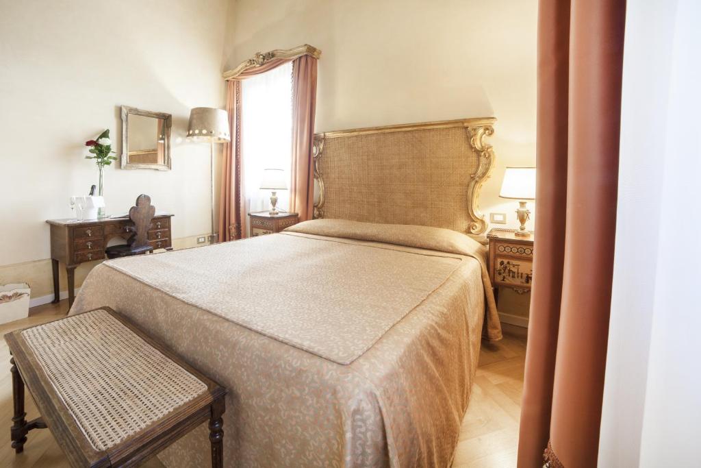 Postel nebo postele na pokoji v ubytování Relais Fra' Lorenzo