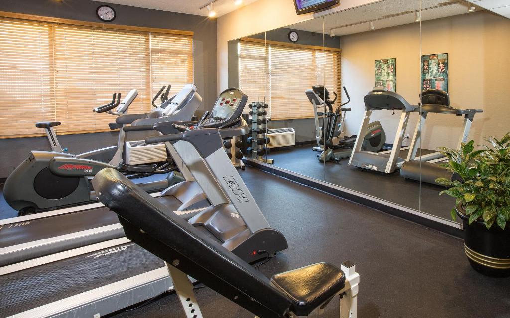 a gym with treadmills and elliptical machines at Coast Gateway Hotel in SeaTac