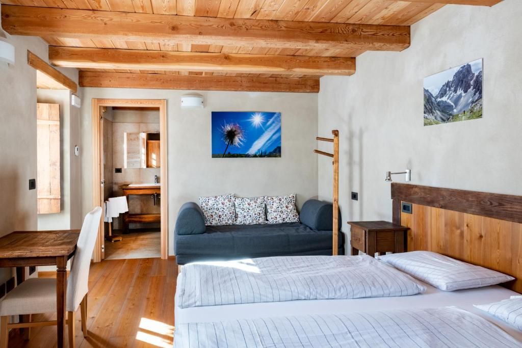 Postel nebo postele na pokoji v ubytování Albergo Locanda Mistral