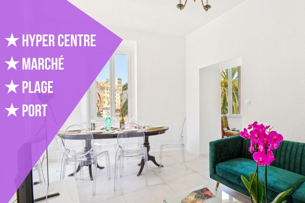 a living room with a table and a green couch at Appartement StelleTratti Madonuccia in Ajaccio