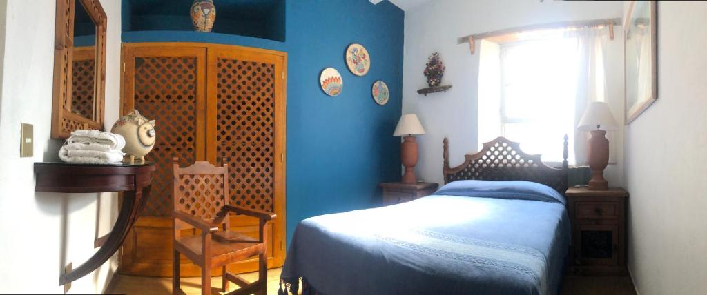 Postel nebo postele na pokoji v ubytování Casa Tecolote