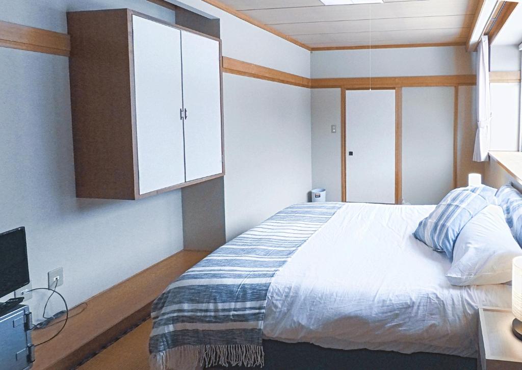 Postel nebo postele na pokoji v ubytování Red Fox Lodge Myoko