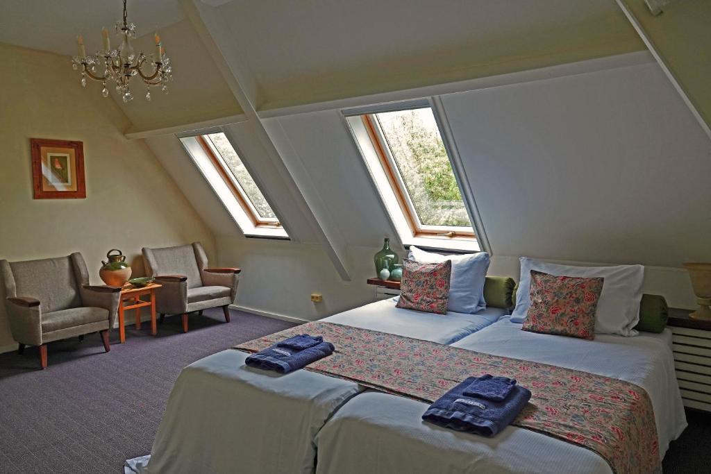Postel nebo postele na pokoji v ubytování B&B Welgelegen