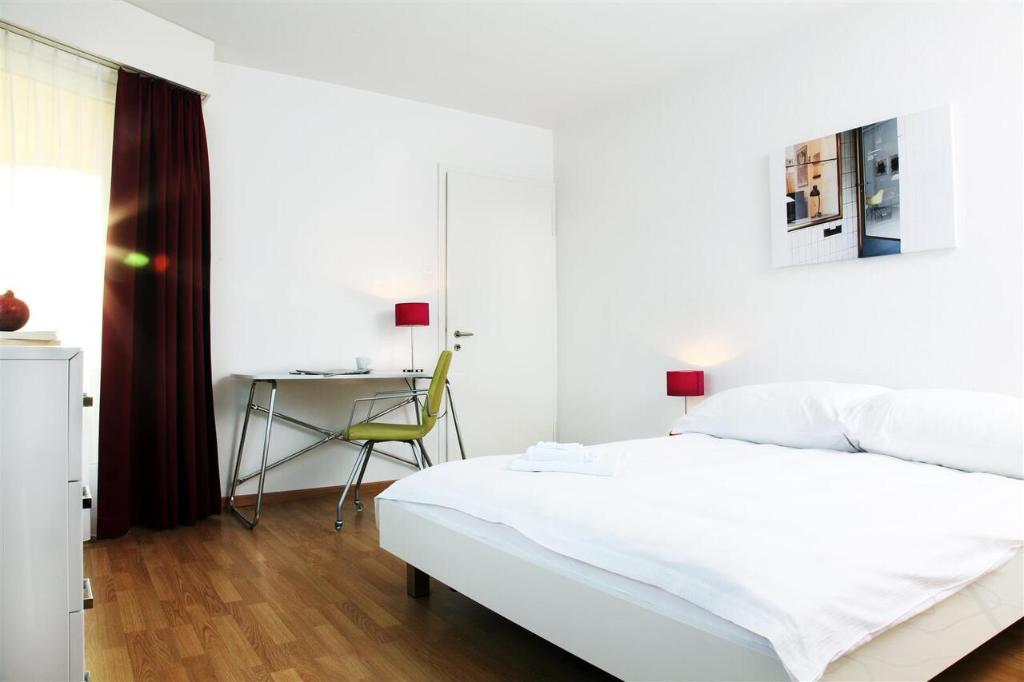 Postel nebo postele na pokoji v ubytování CITY STAY - Forchstrasse