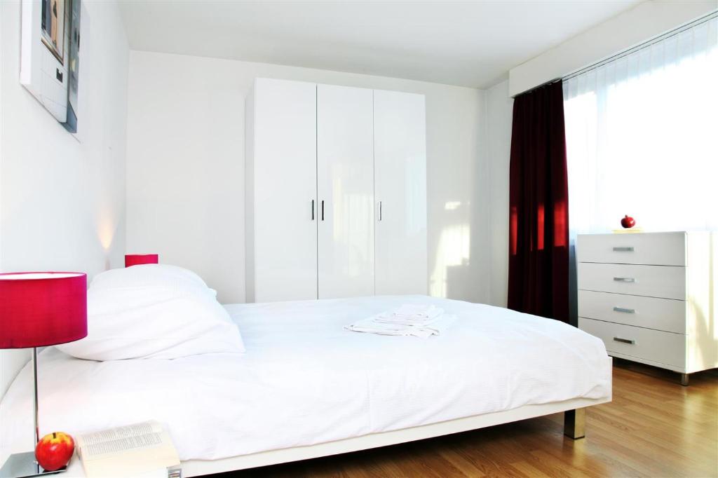 Postel nebo postele na pokoji v ubytování CITY STAY - Forchstrasse