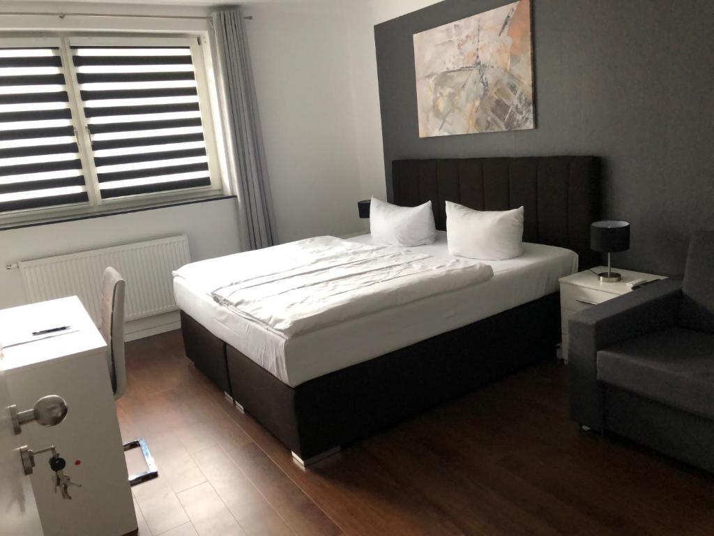 Postel nebo postele na pokoji v ubytování Hotel Teatro