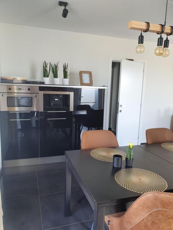 Kuchyň nebo kuchyňský kout v ubytování B&B Kanegem Onverbloemd