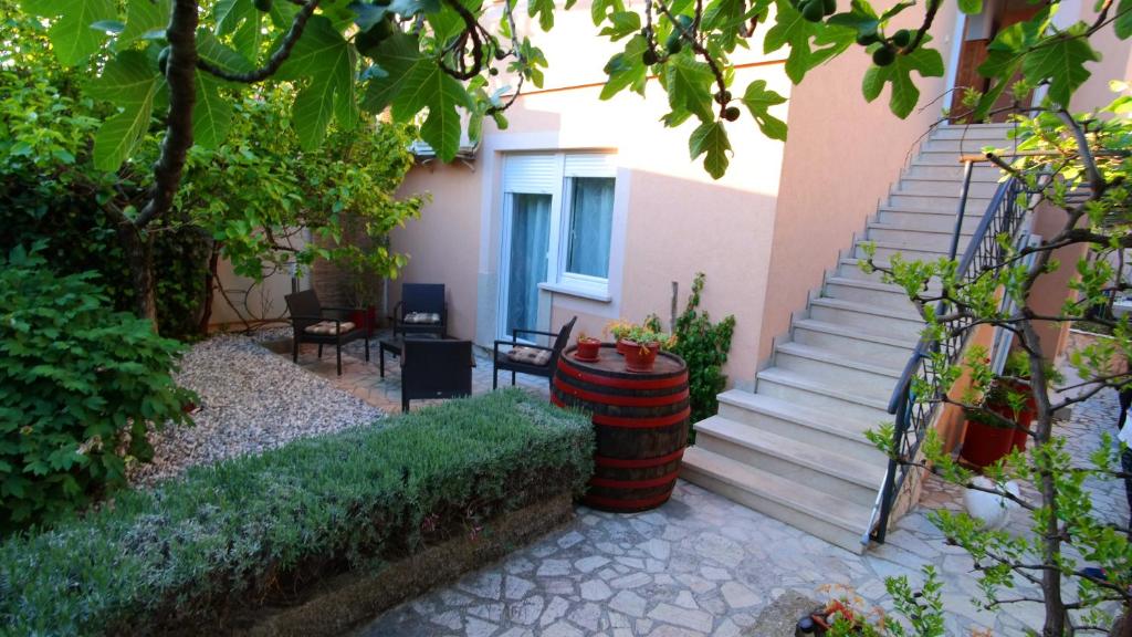 a house with a staircase and a stair case at Morena in Pula