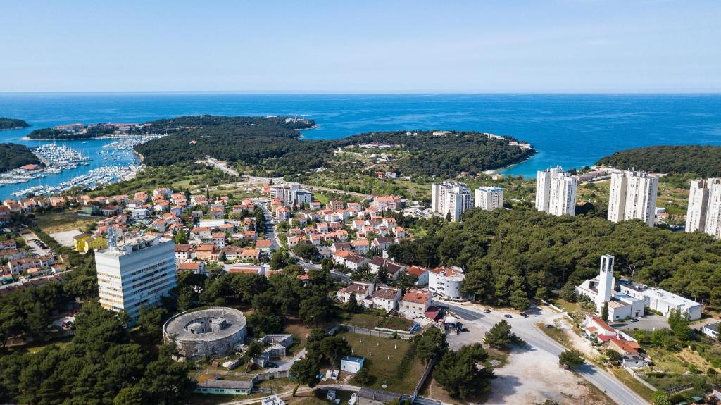 an aerial view of a city and the ocean at Morena in Pula