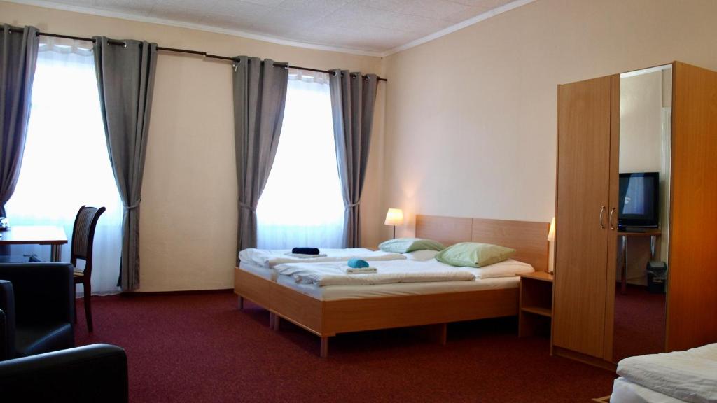 Postel nebo postele na pokoji v ubytování Pension Village