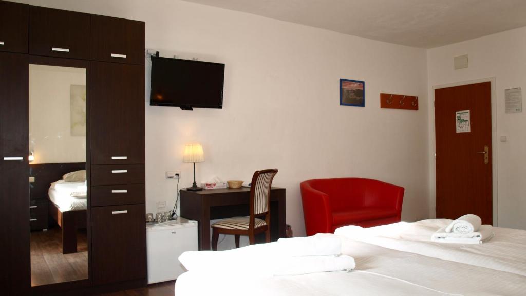 Postel nebo postele na pokoji v ubytování Pension Village
