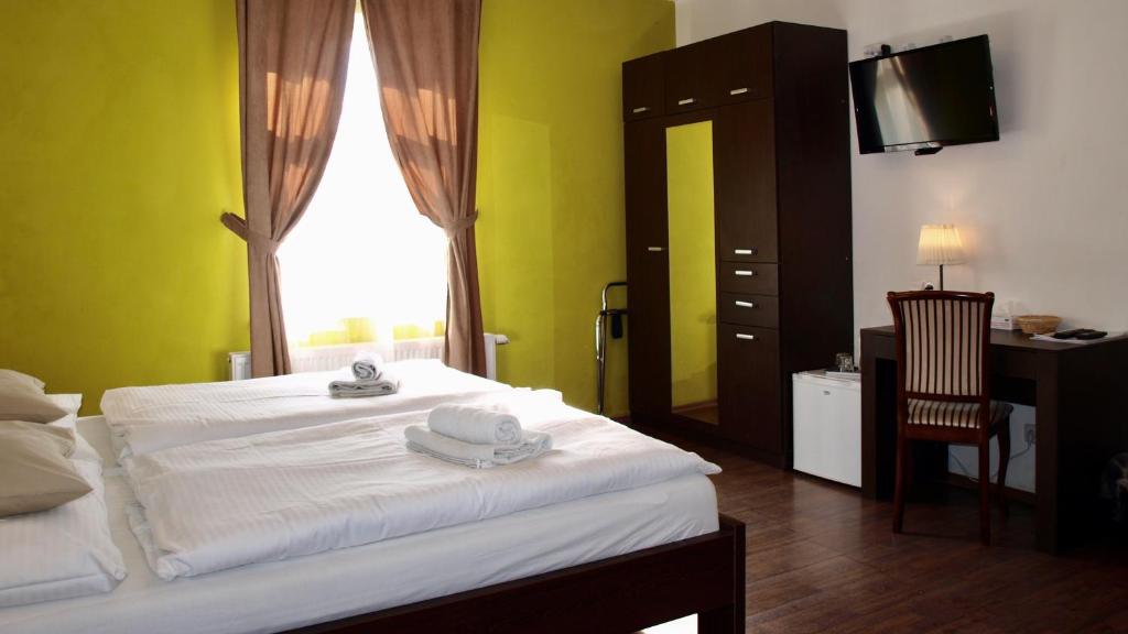 Postel nebo postele na pokoji v ubytování Pension Village