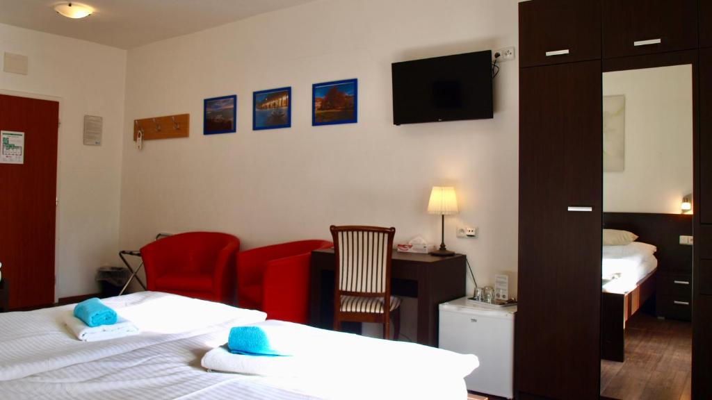 Postel nebo postele na pokoji v ubytování Pension Village