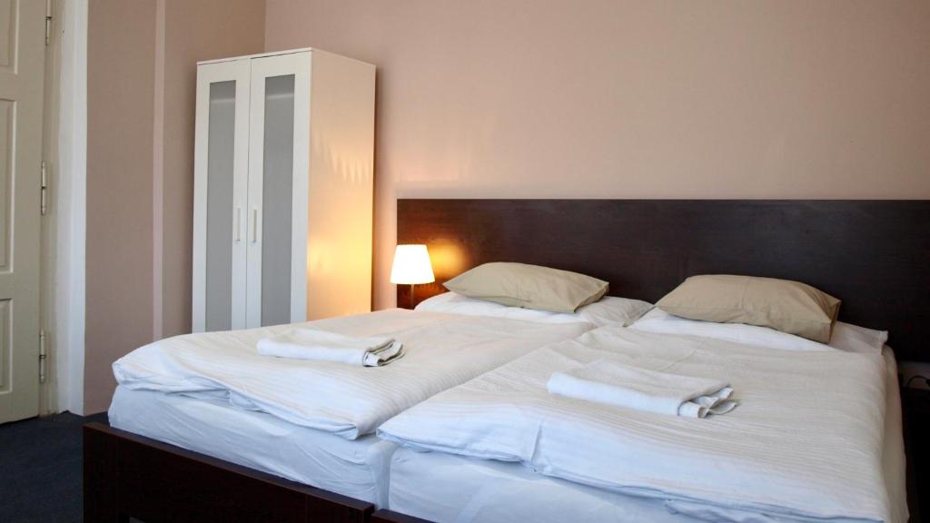 Postel nebo postele na pokoji v ubytování Pension Village