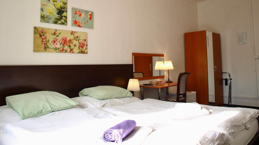 Postel nebo postele na pokoji v ubytování Pension Village