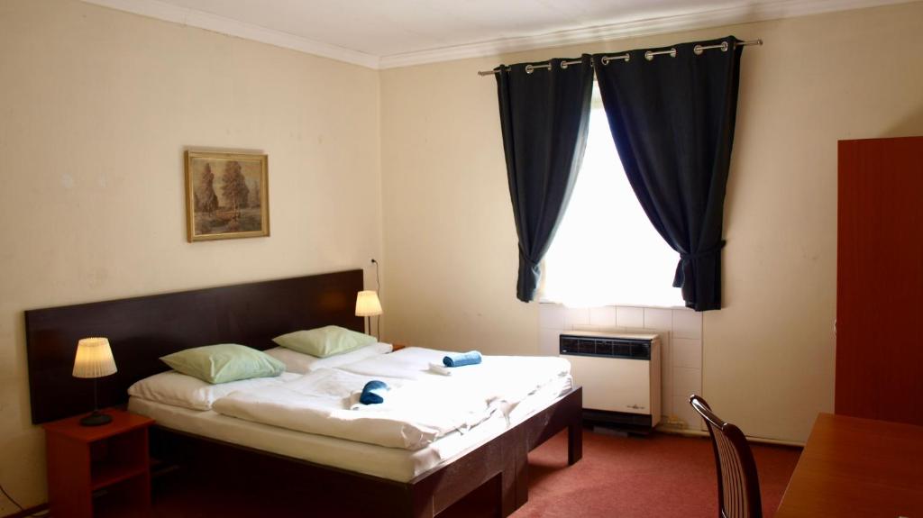 Postel nebo postele na pokoji v ubytování Pension Village