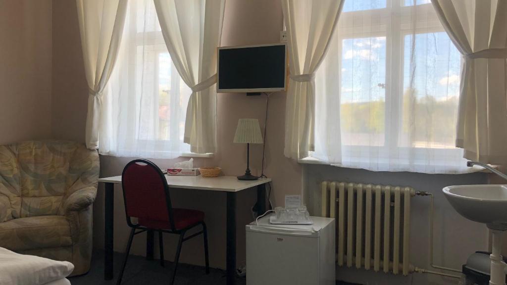TV a/nebo společenská místnost v ubytování Pension Village