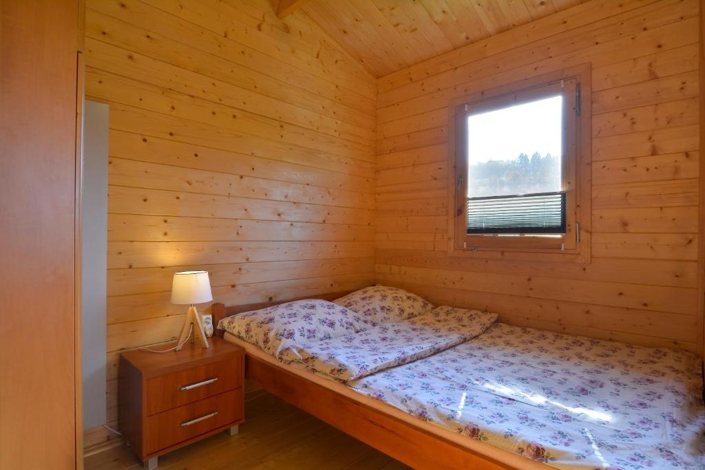Posteľ alebo postele v izbe v ubytovaní Domek nad Rozlewiskiem