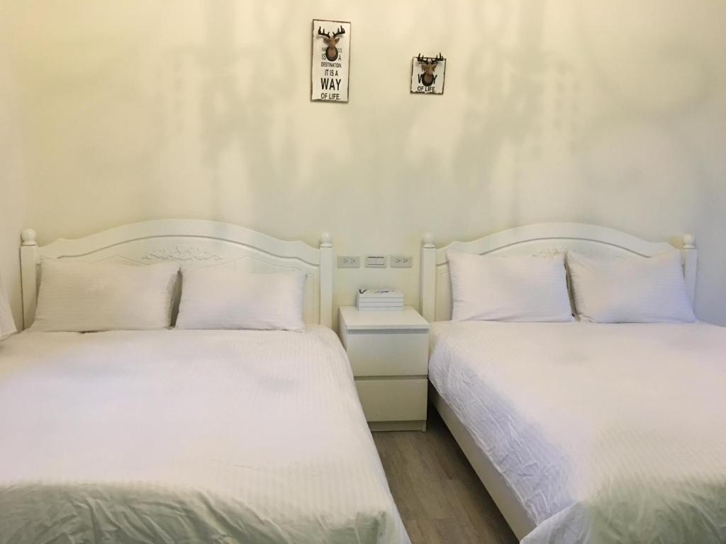 Postel nebo postele na pokoji v ubytování 稻哪趣田園民宿 平價villa
