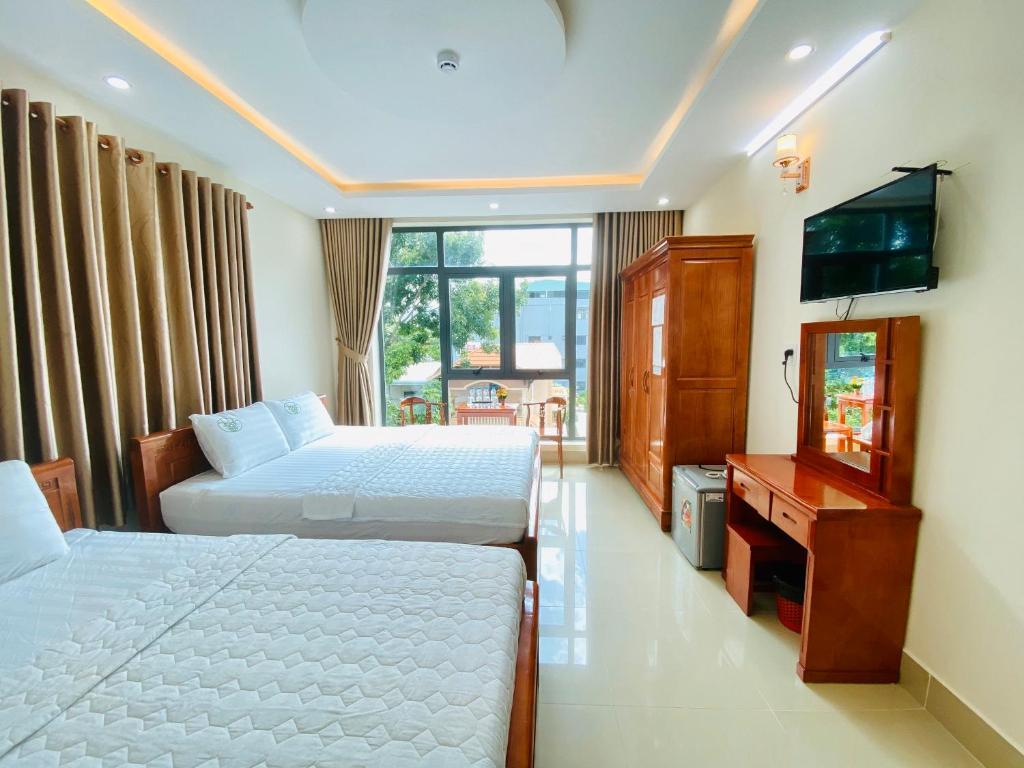 Postel nebo postele na pokoji v ubytování Khách sạn Phúc Lộc An Côn Đảo