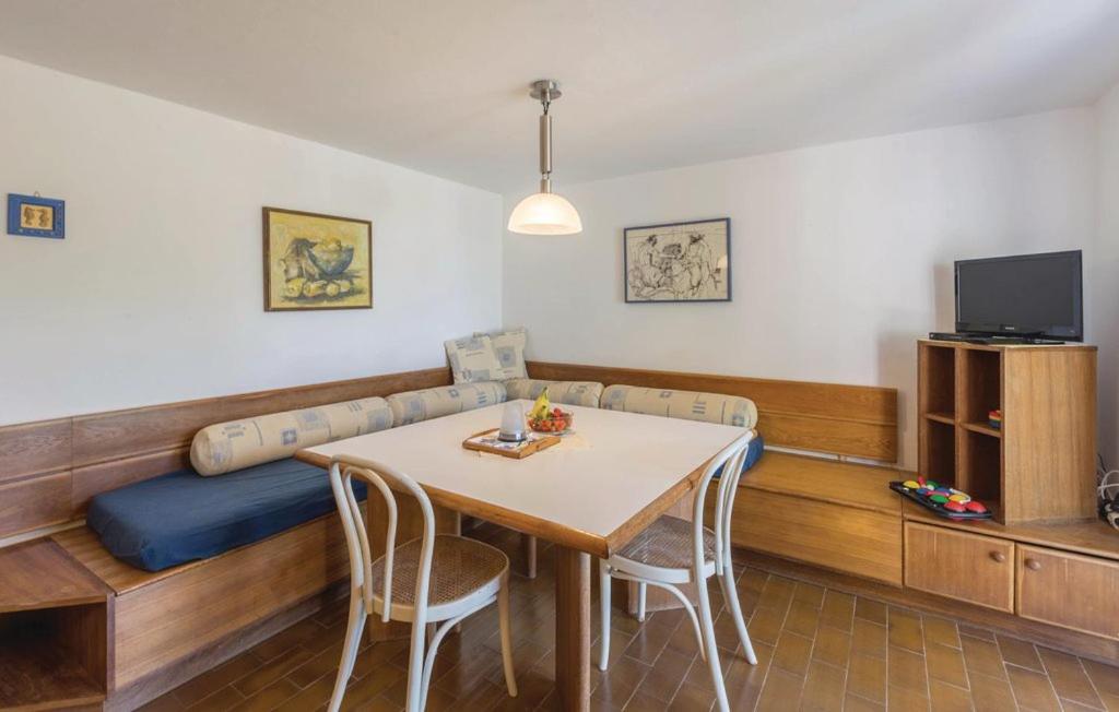 Televízia a/alebo spoločenská miestnosť v ubytovaní Casa Rocco