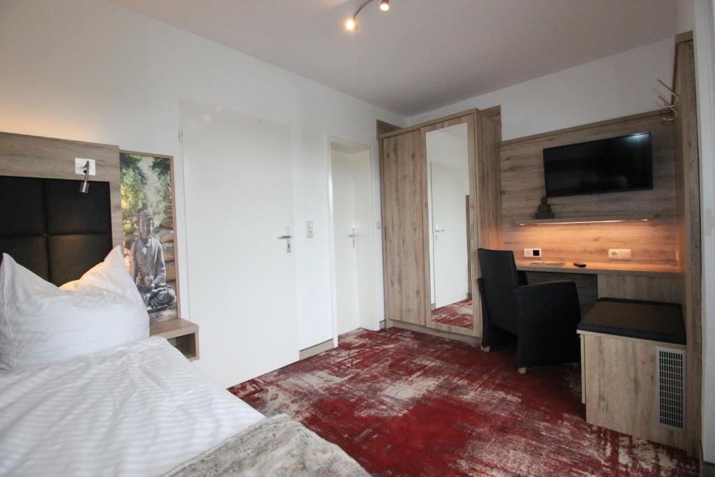 Postel nebo postele na pokoji v ubytování Wellness & Ayurveda Hotel Am Eichenberg