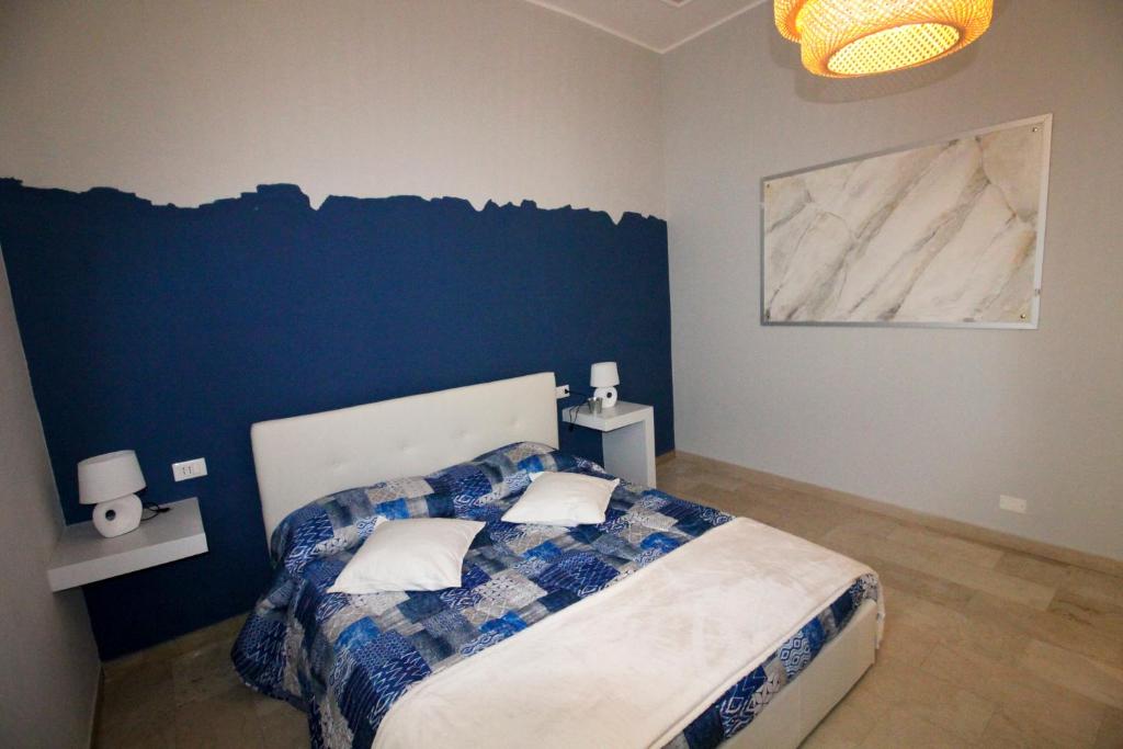 Postel nebo postele na pokoji v ubytování Ad Astra Rooms