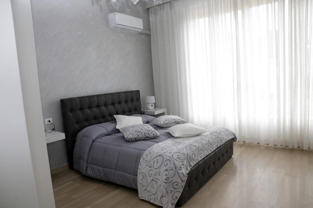Postel nebo postele na pokoji v ubytování Ad Astra Rooms