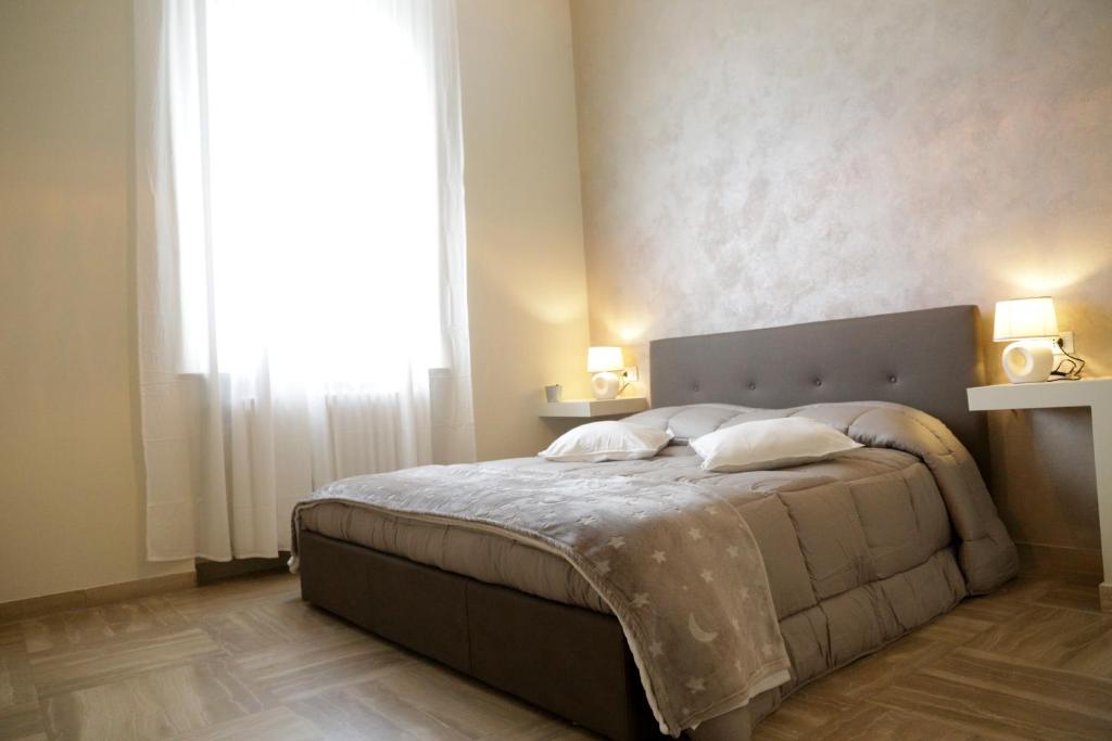 Postel nebo postele na pokoji v ubytování Ad Astra Rooms