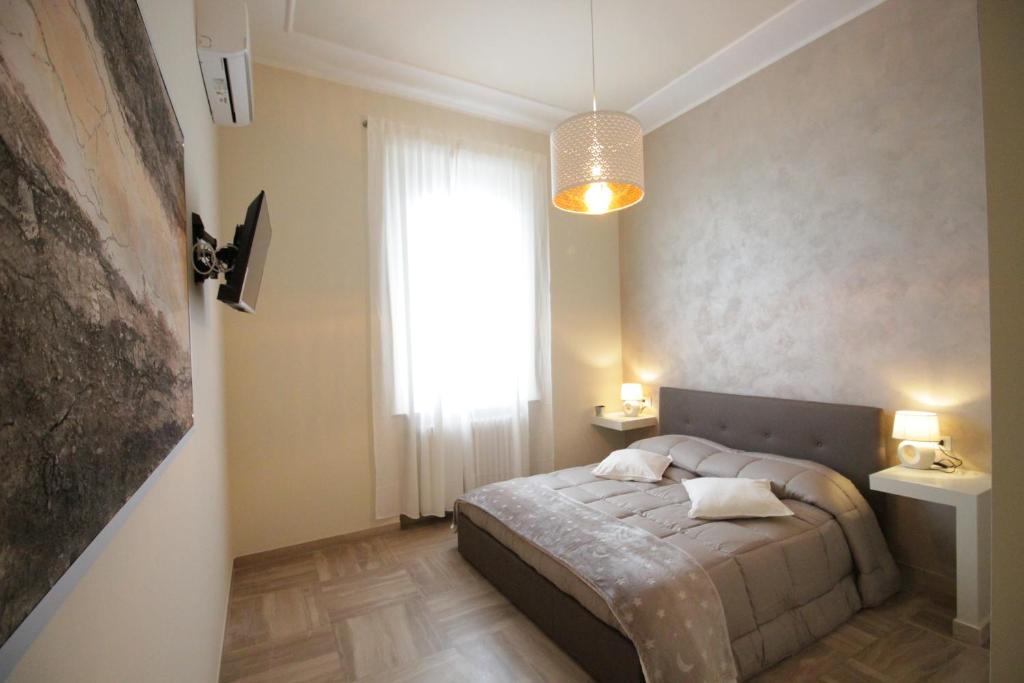 Postel nebo postele na pokoji v ubytování Ad Astra Rooms