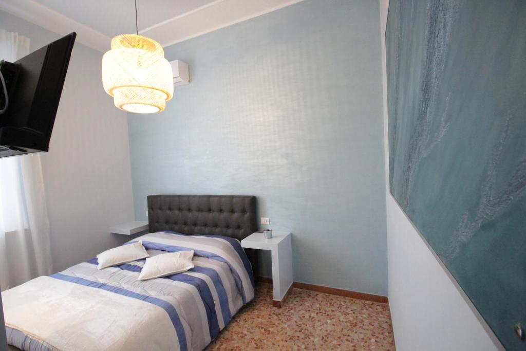 Postel nebo postele na pokoji v ubytování Ad Astra Rooms