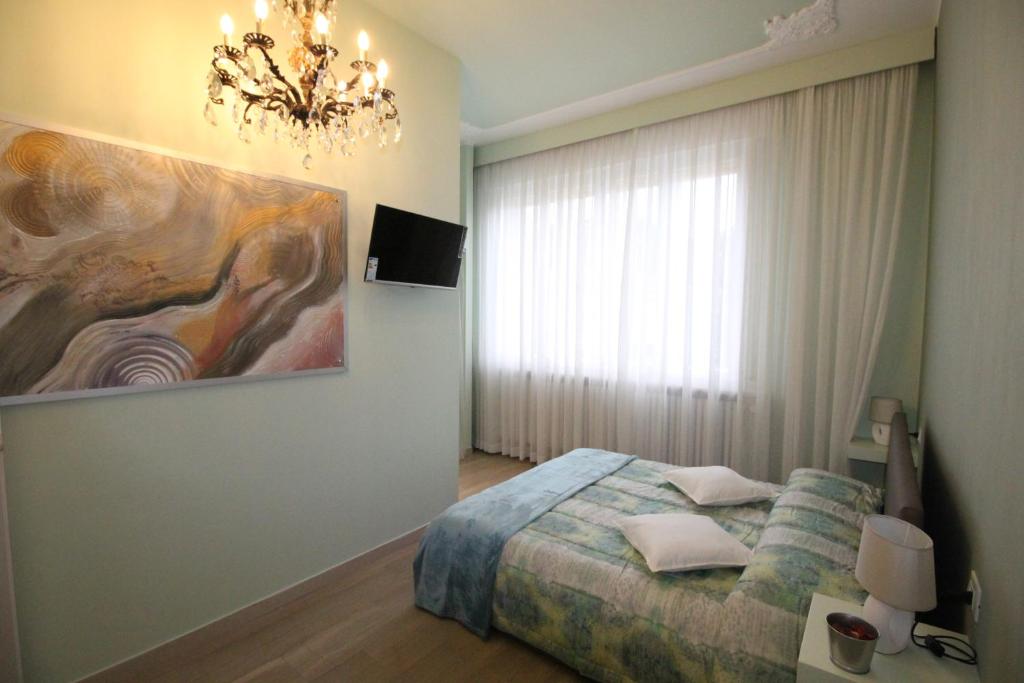 Postel nebo postele na pokoji v ubytování Ad Astra Rooms