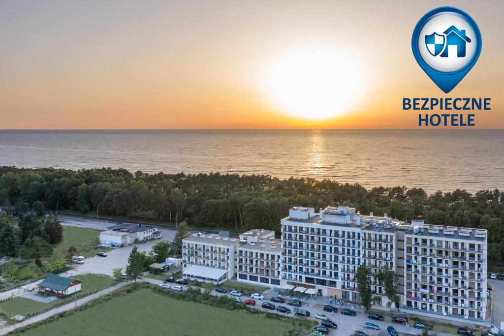 an aerial view of the excellence hotel at sunset at Blue Marine Mielno in Mielno